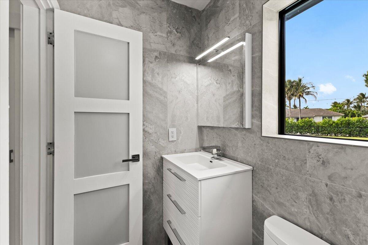 1049 West Palmetto Park Road Boca Raton, FL 33486 - Photo 19 of 40 a utility room with a sink dryer and washer