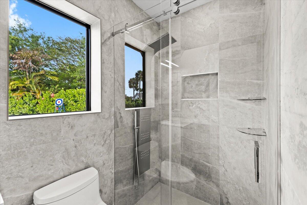 1049 West Palmetto Park Road Boca Raton, FL 33486 - Photo 20 of 40 a bathroom with a shower and toilet