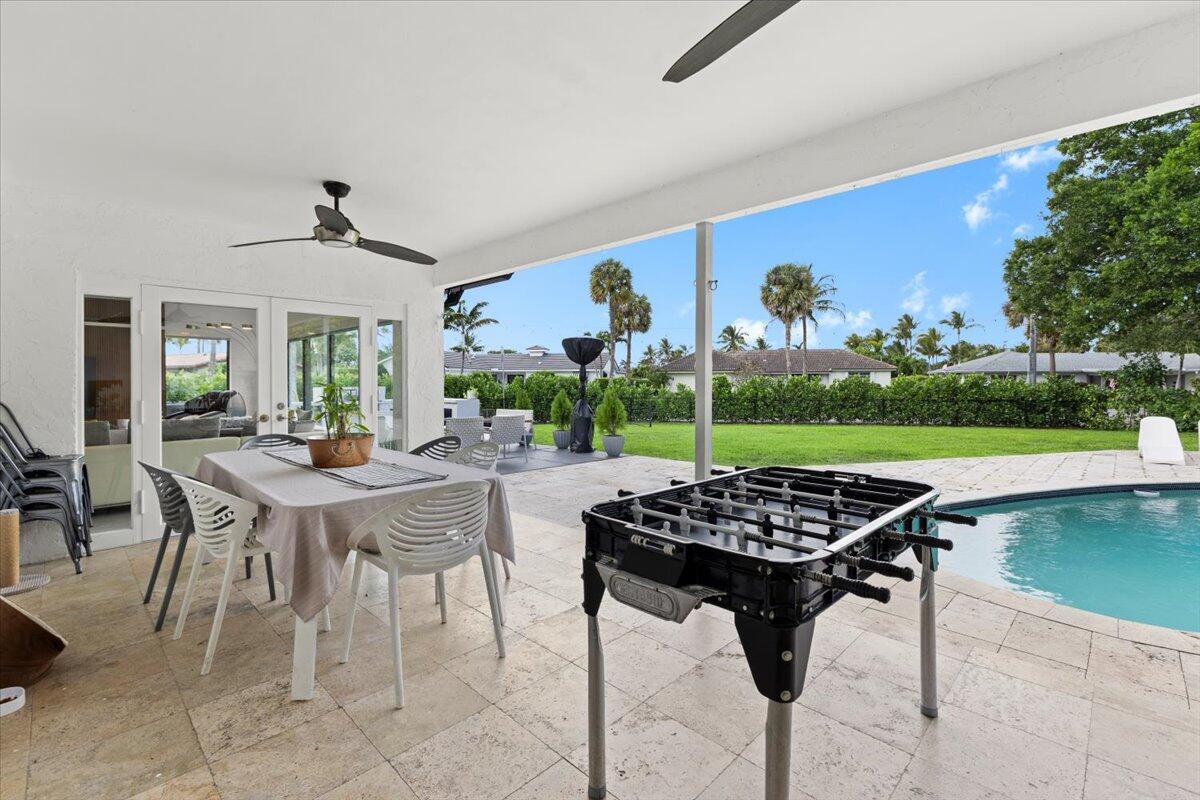 1049 West Palmetto Park Road Boca Raton, FL 33486 - Photo 27 of 40 a view of a livingroom with furniture and garden