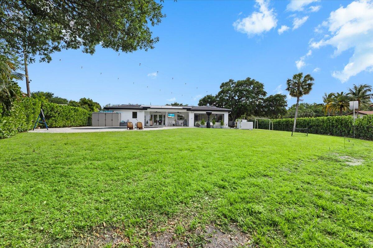 1049 West Palmetto Park Road Boca Raton, FL 33486 - Photo 34 of 40 a view of house with a big yard