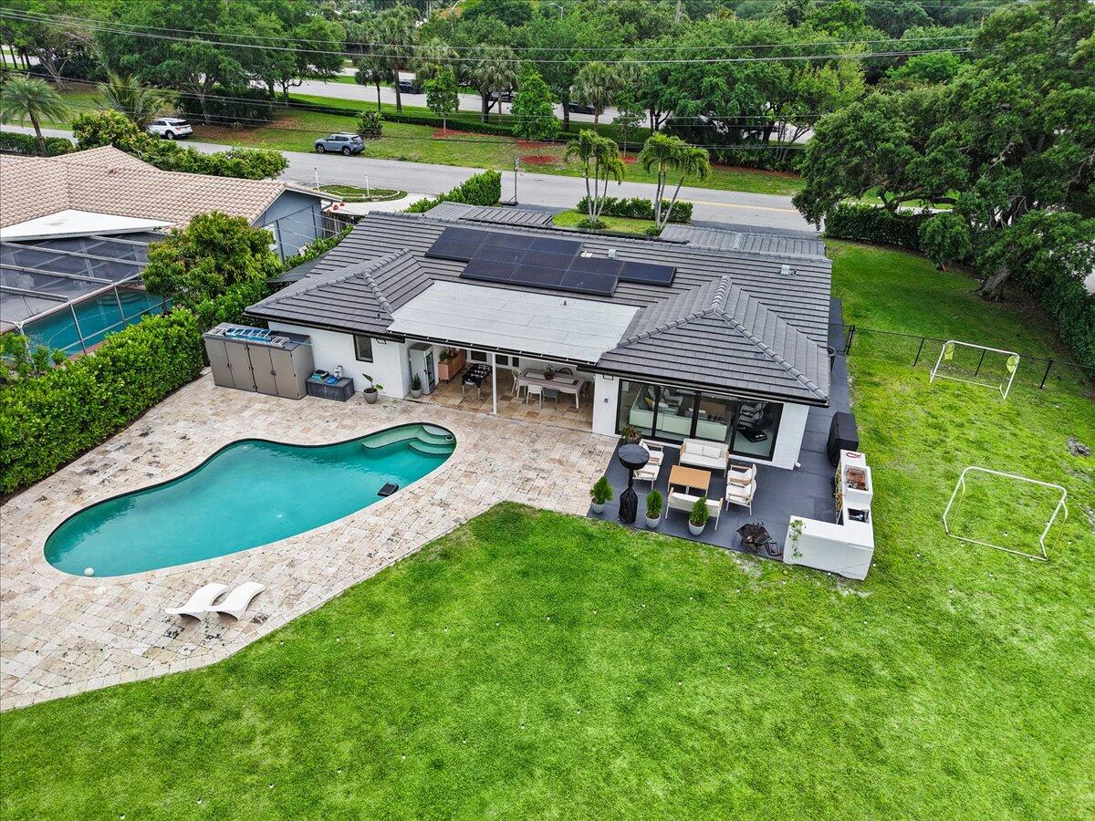 1049 West Palmetto Park Road Boca Raton, FL 33486 - Photo 36 of 40 an aerial view of a house with garden space and street view