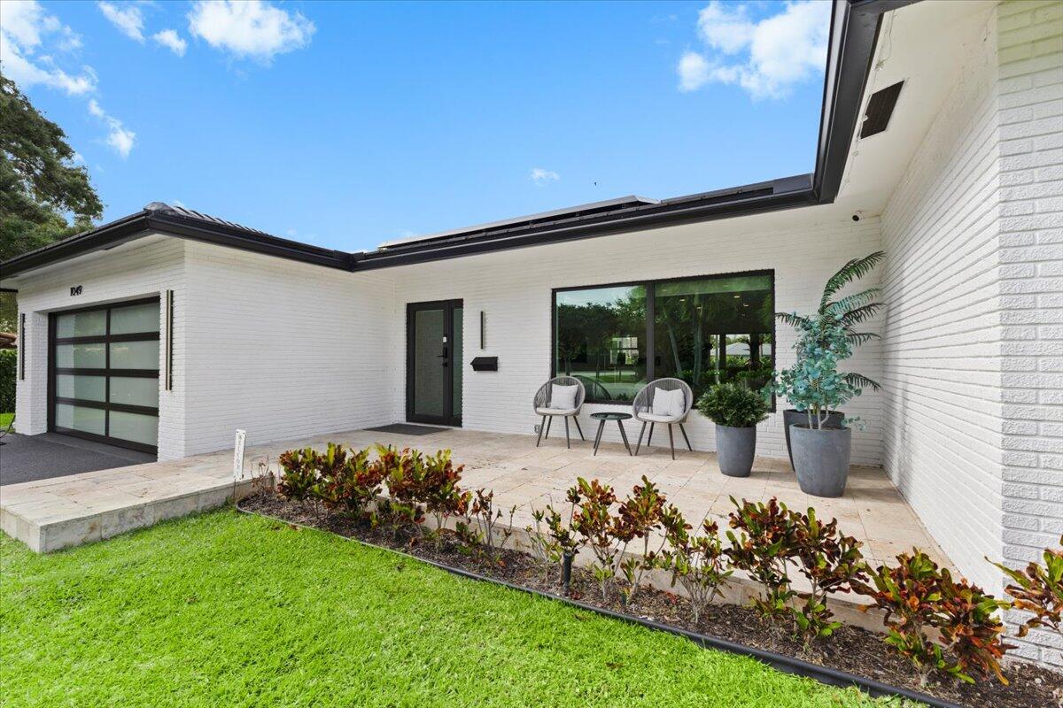 1049 West Palmetto Park Road Boca Raton, FL 33486 - Photo 4 of 40 a view of a house with backyard porch and sitting area