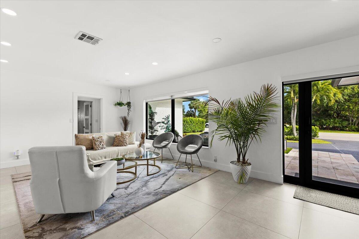 1049 West Palmetto Park Road Boca Raton, FL 33486 - Photo 7 of 40 a living room with furniture and a large window