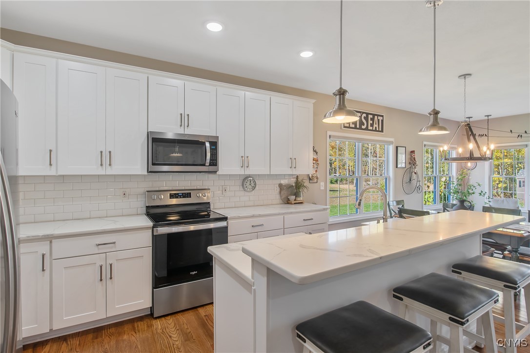 4304 Tiger Lily Path Clay, NY 13090 - Photo 11 of 50 Island with prep space and seating