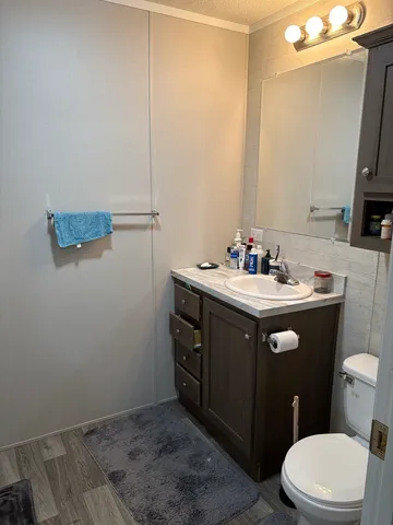 a bathroom with a glass shower door