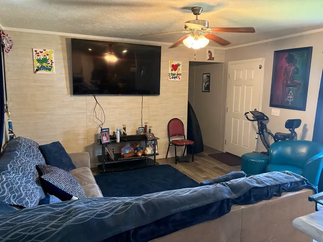 a living room with furniture and a flat screen tv