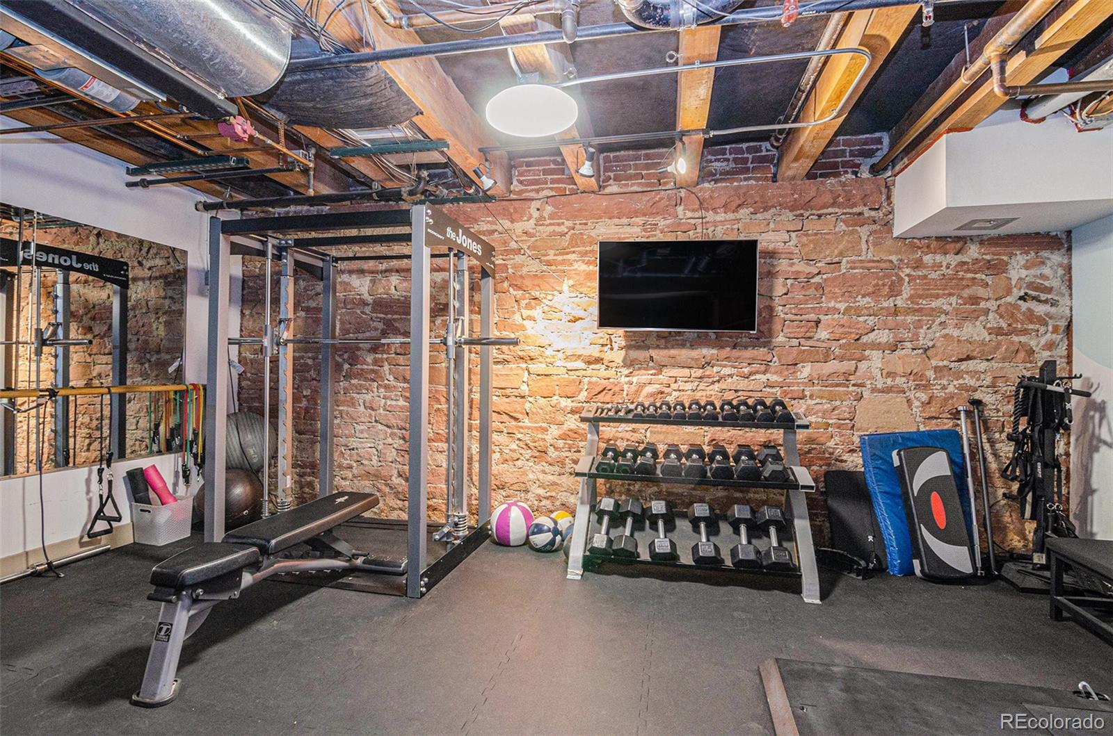 2960 Inca Street, Unit 417 Denver, CO 80202 - Photo 12 of 14 a view of a room with gym equipment