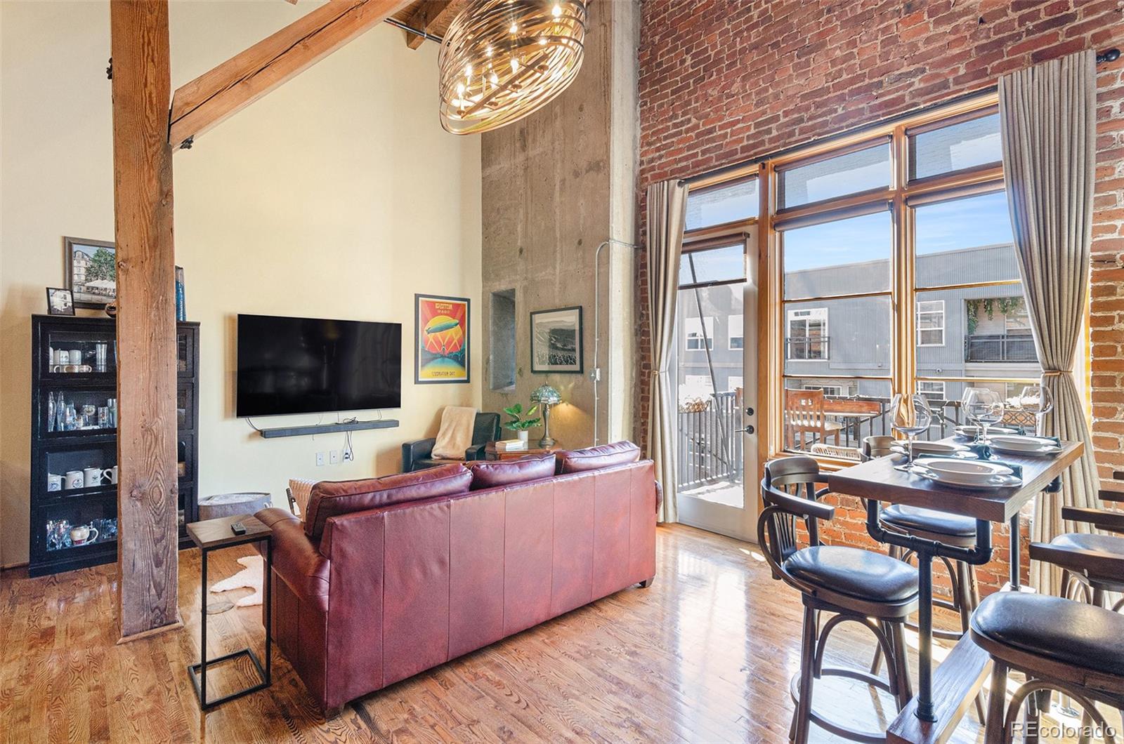 2960 Inca Street, Unit 417 Denver, CO 80202 - Photo 2 of 14 a living room with furniture and a flat screen tv