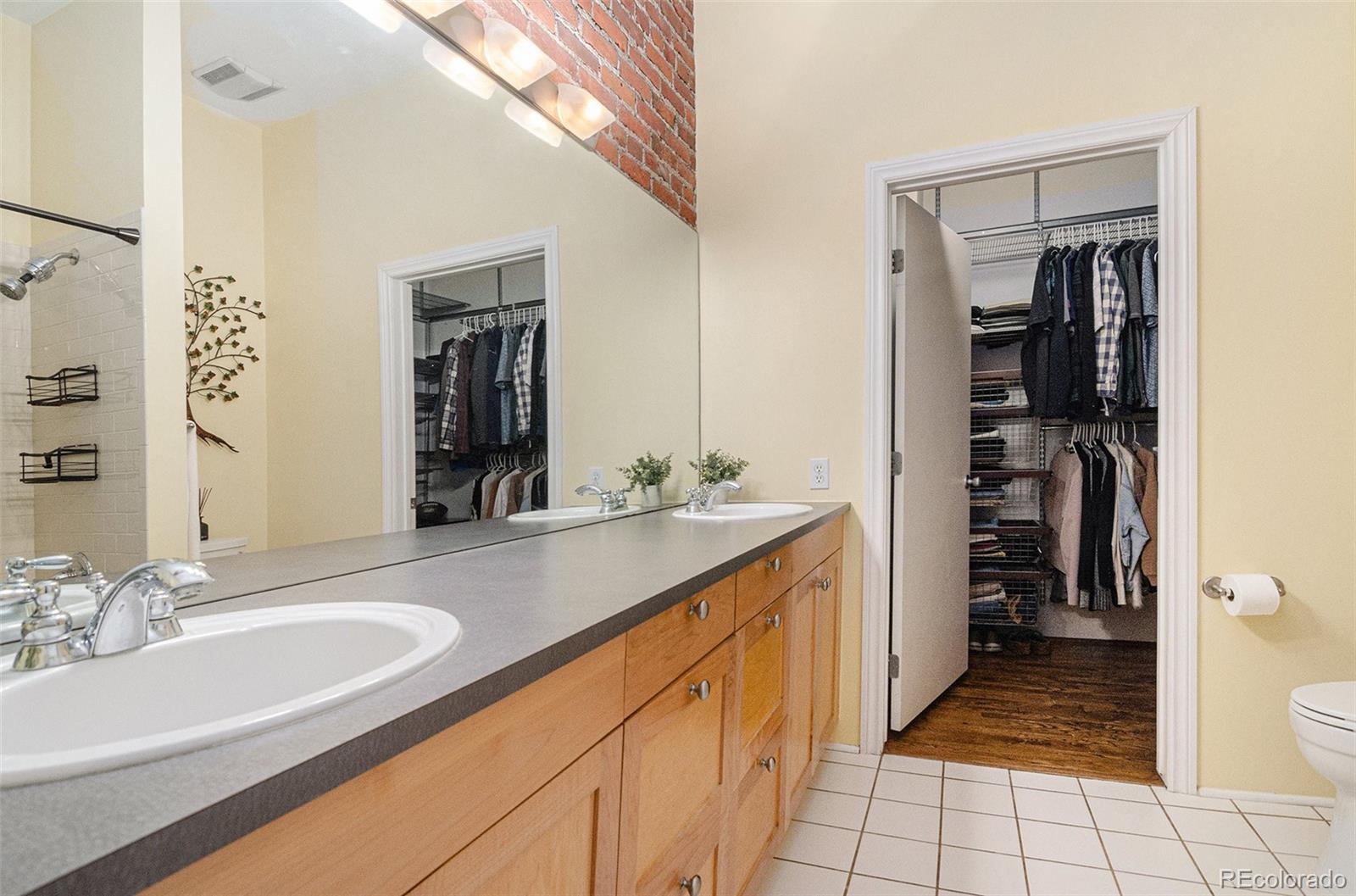 2960 Inca Street, Unit 417 Denver, CO 80202 - Photo 8 of 14 a bathroom with a sink double vanity