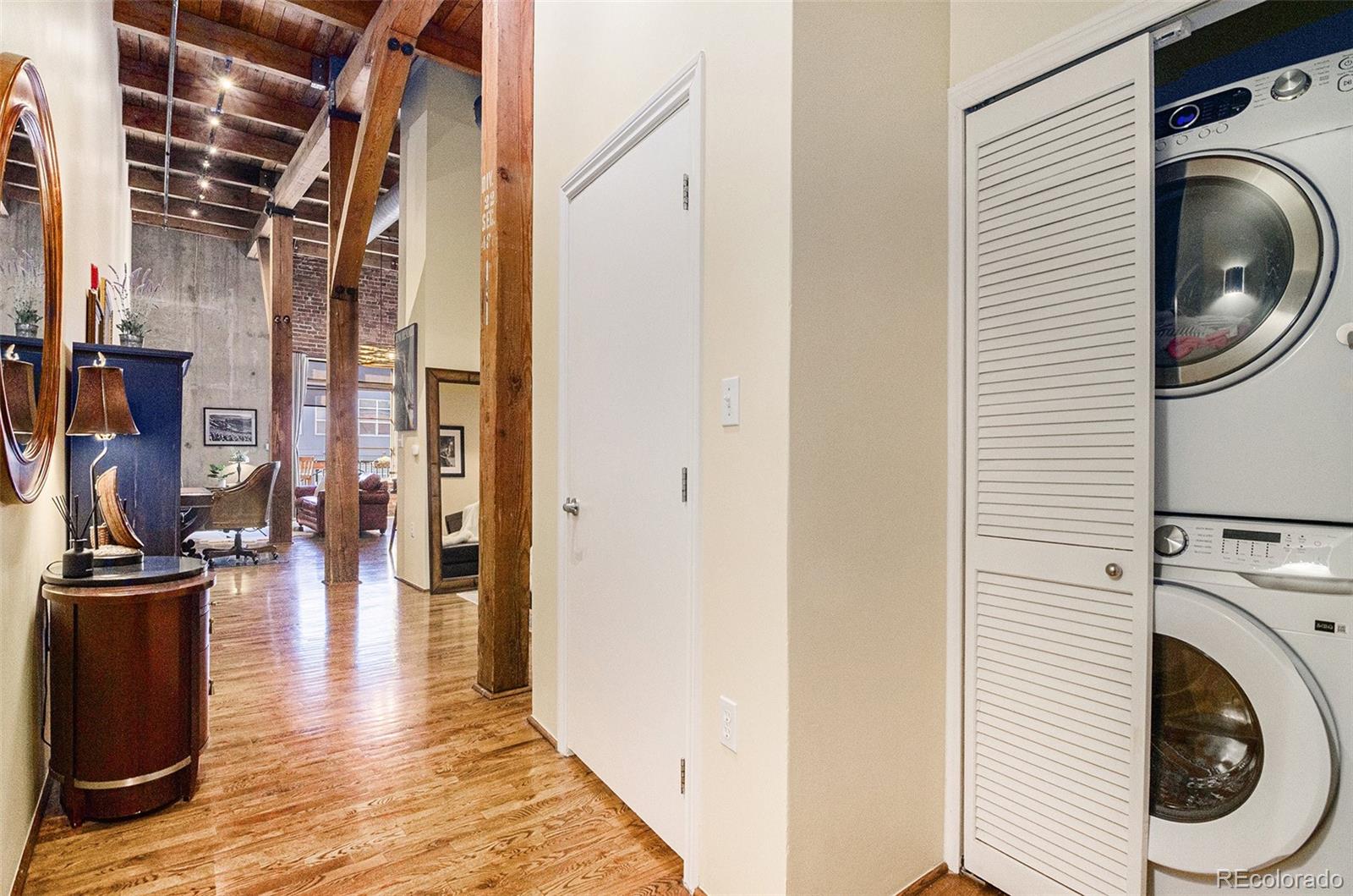 2960 Inca Street, Unit 417 Denver, CO 80202 - Photo 9 of 14 a view of a hallway with washer and dryer