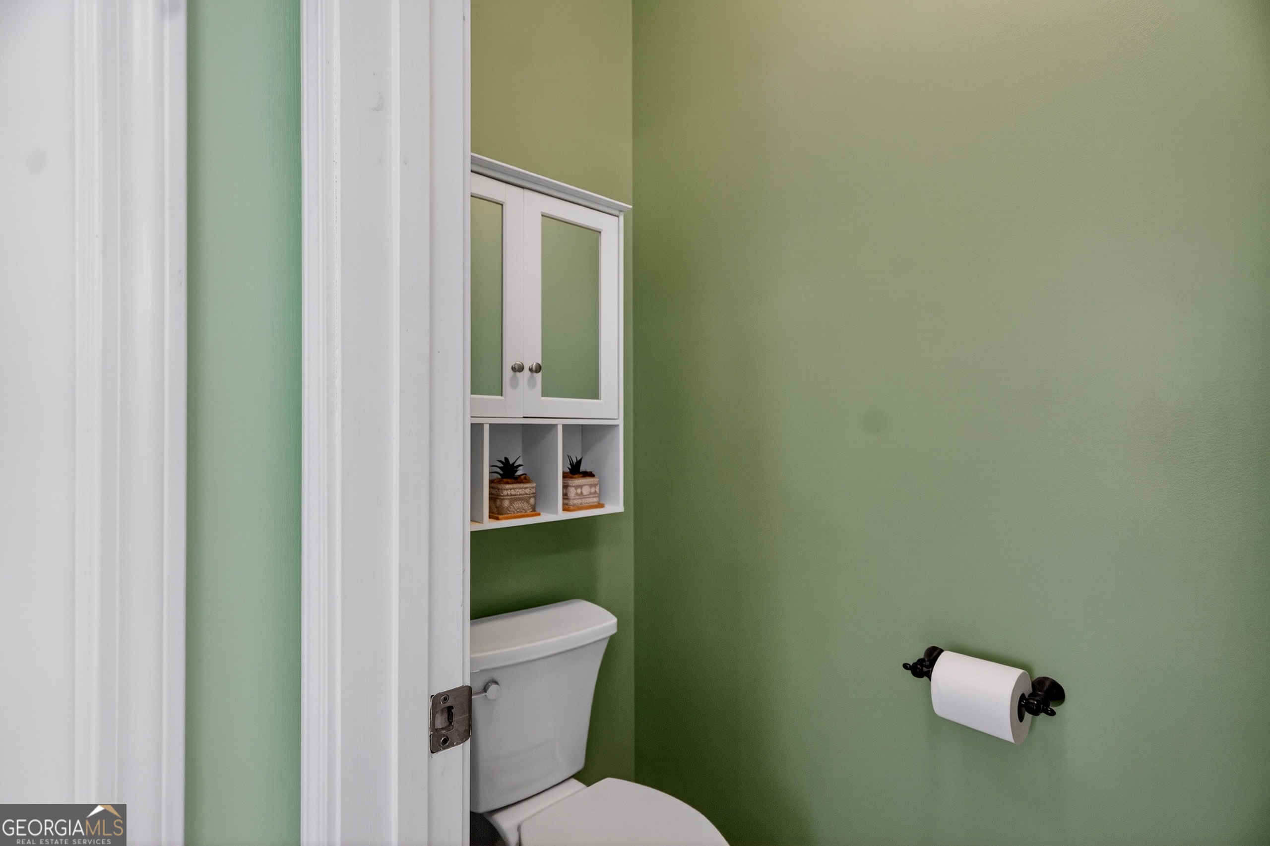 830 John Lovelace Road LaGrange, GA 30241 - Photo 23 of 45 a white toilet sitting next to a bathroom sink