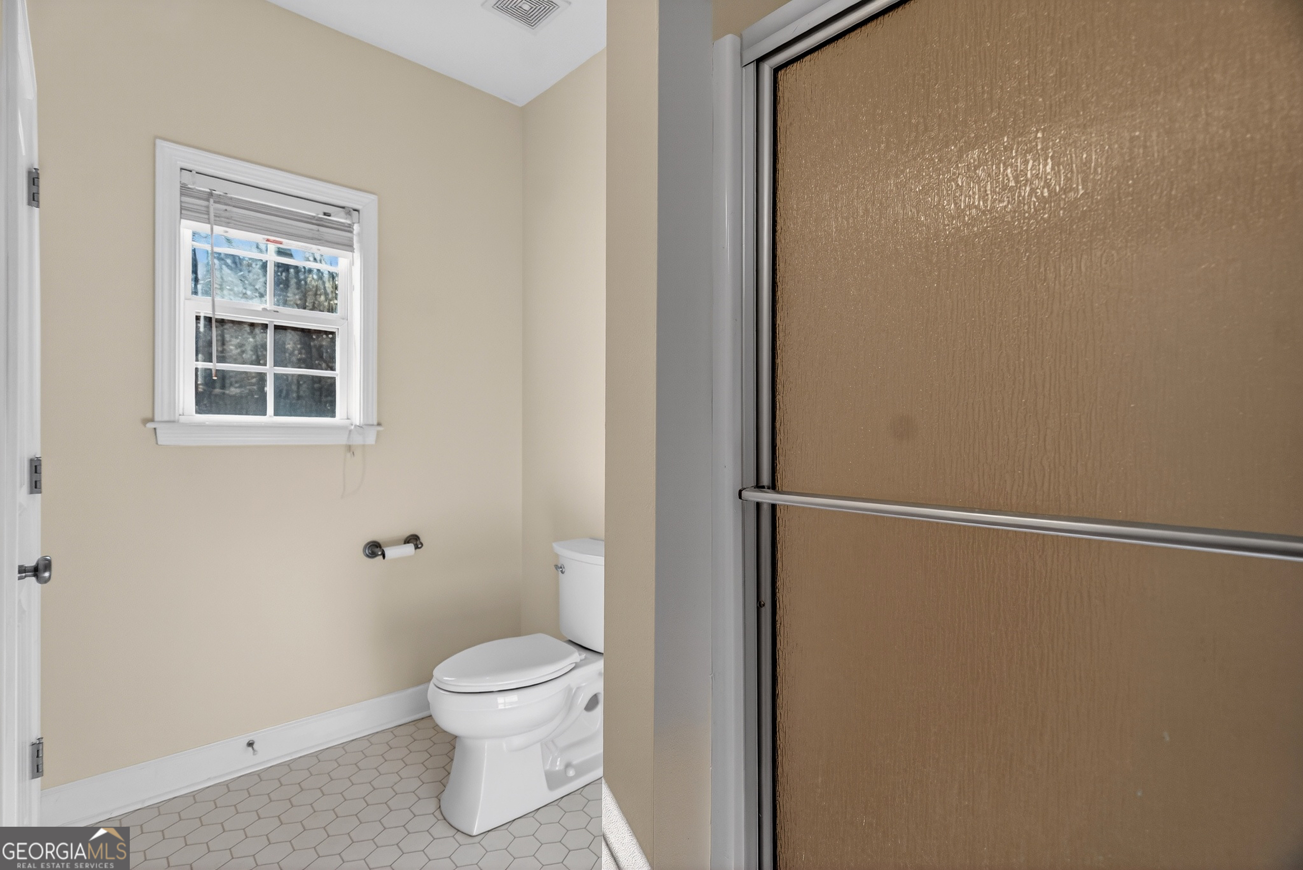 830 John Lovelace Road LaGrange, GA 30241 - Photo 26 of 45 a bathroom with a toilet and a shower