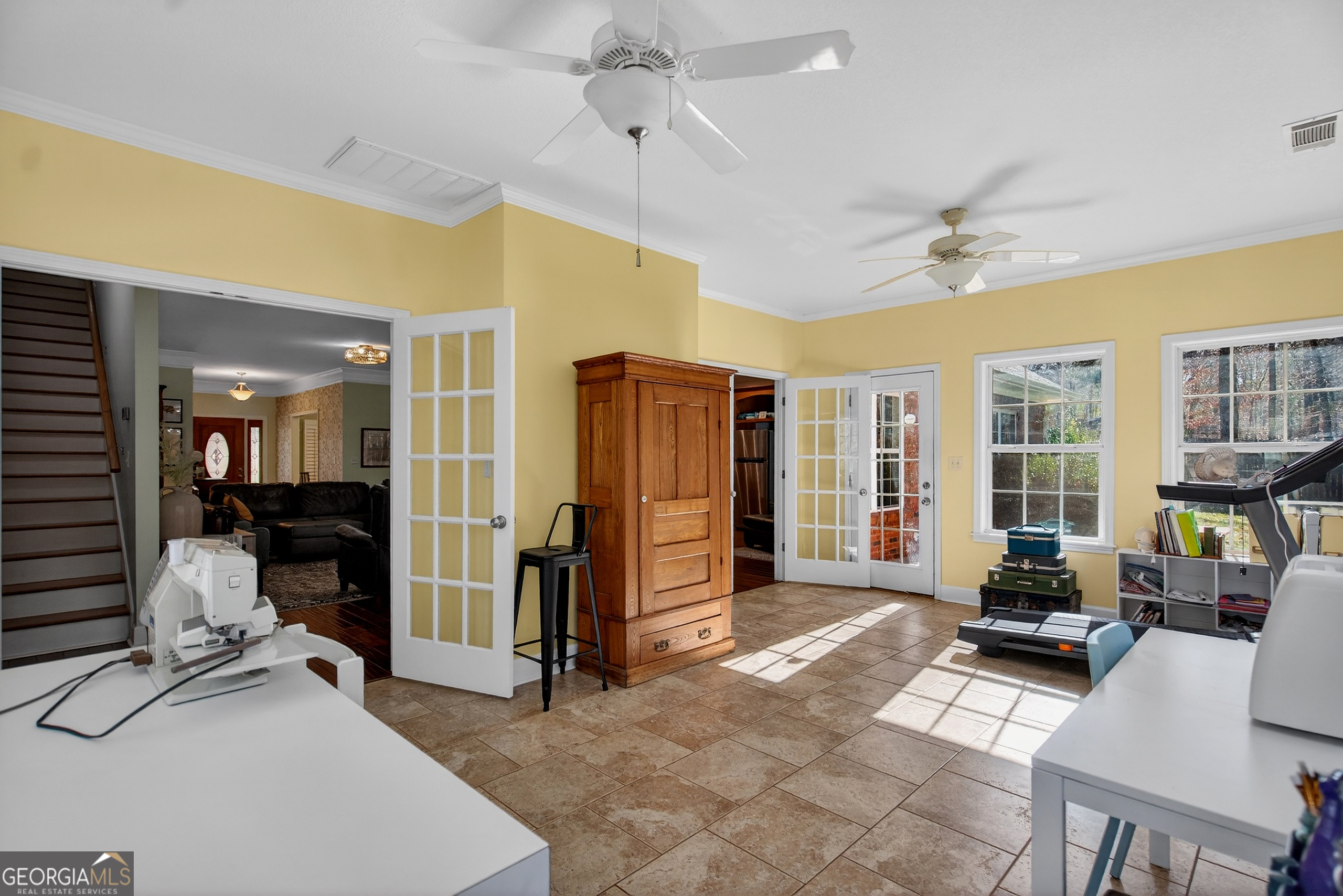 830 John Lovelace Road LaGrange, GA 30241 - Photo 30 of 45 a living room with furniture a large window and gym equipment