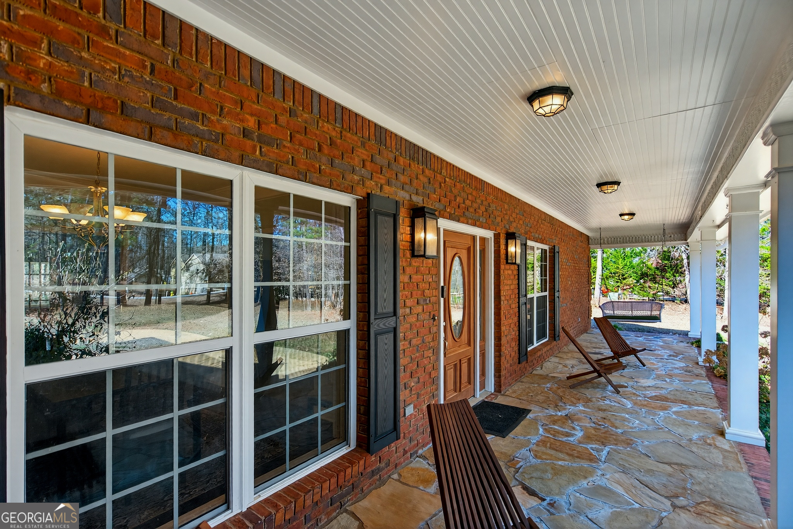 830 John Lovelace Road LaGrange, GA 30241 - Photo 3 of 45 a view of a porch with wooden floor and iron stairs