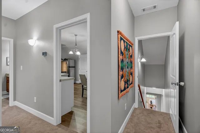 a view of an entryway with wooden floor