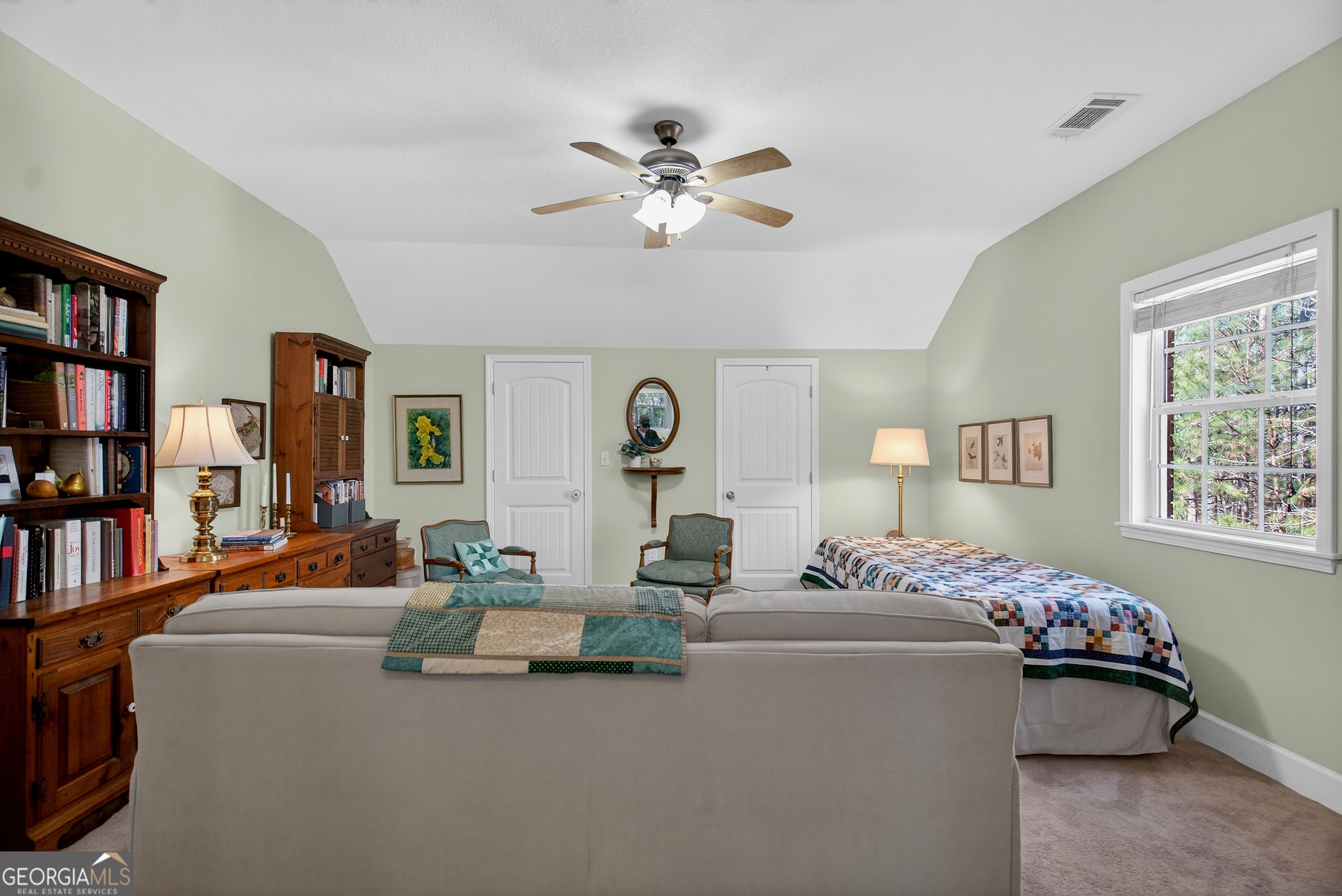 830 John Lovelace Road LaGrange, GA 30241 - Photo 33 of 45 a living room with furniture and a book shelf