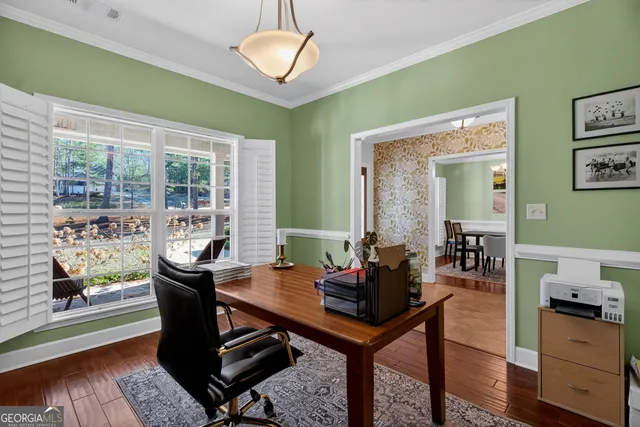 a view of a dining room with furniture window and wooden floor