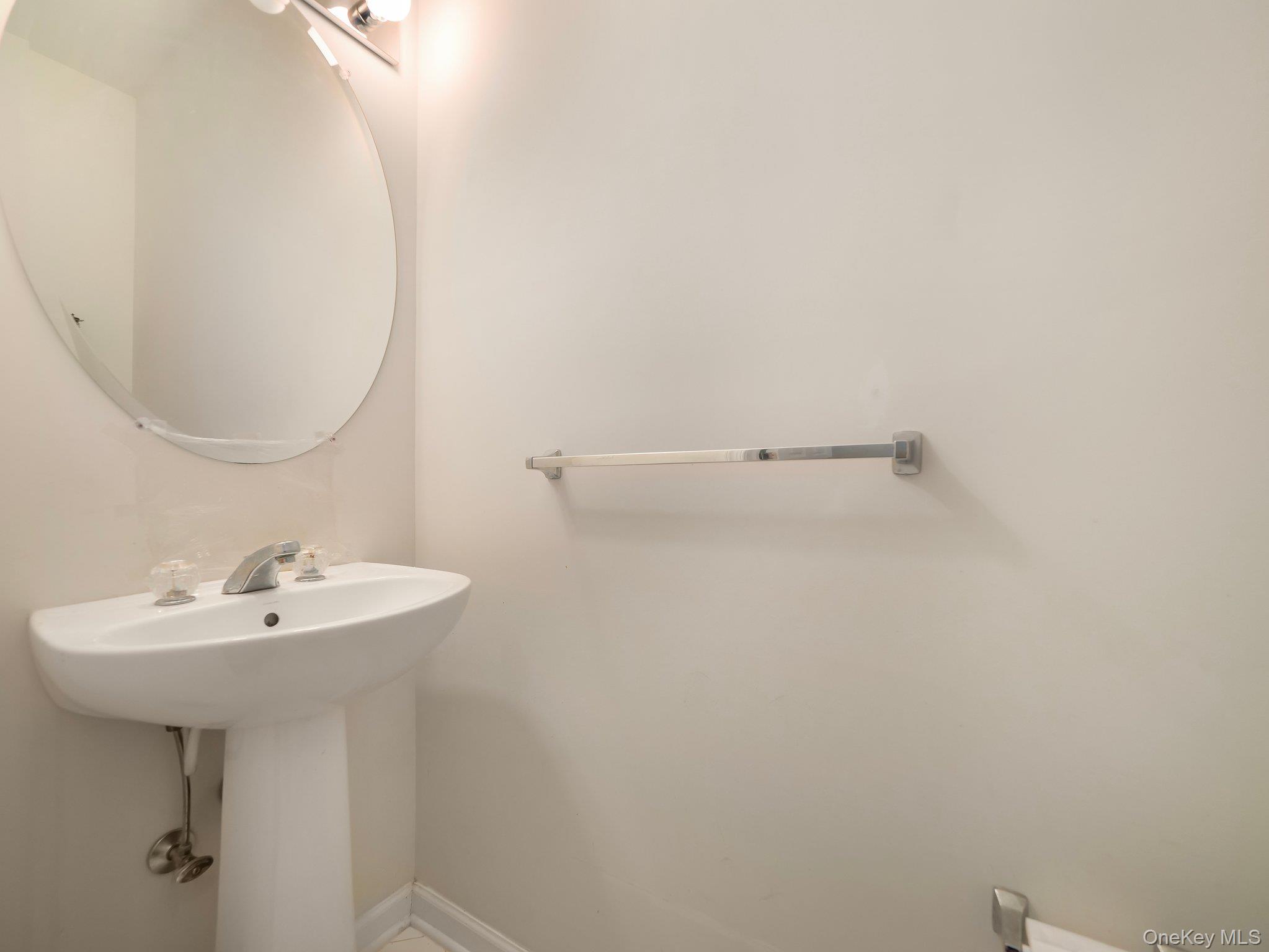 417 Vassar Place Fishkill, NY 12524 - Photo 18 of 38 a bathroom with a sink a mirror and a toilet
