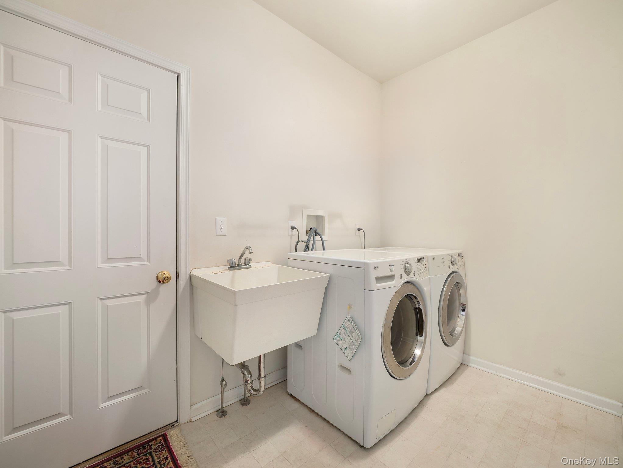 417 Vassar Place Fishkill, NY 12524 - Photo 19 of 38 a utility room with dryer and washer