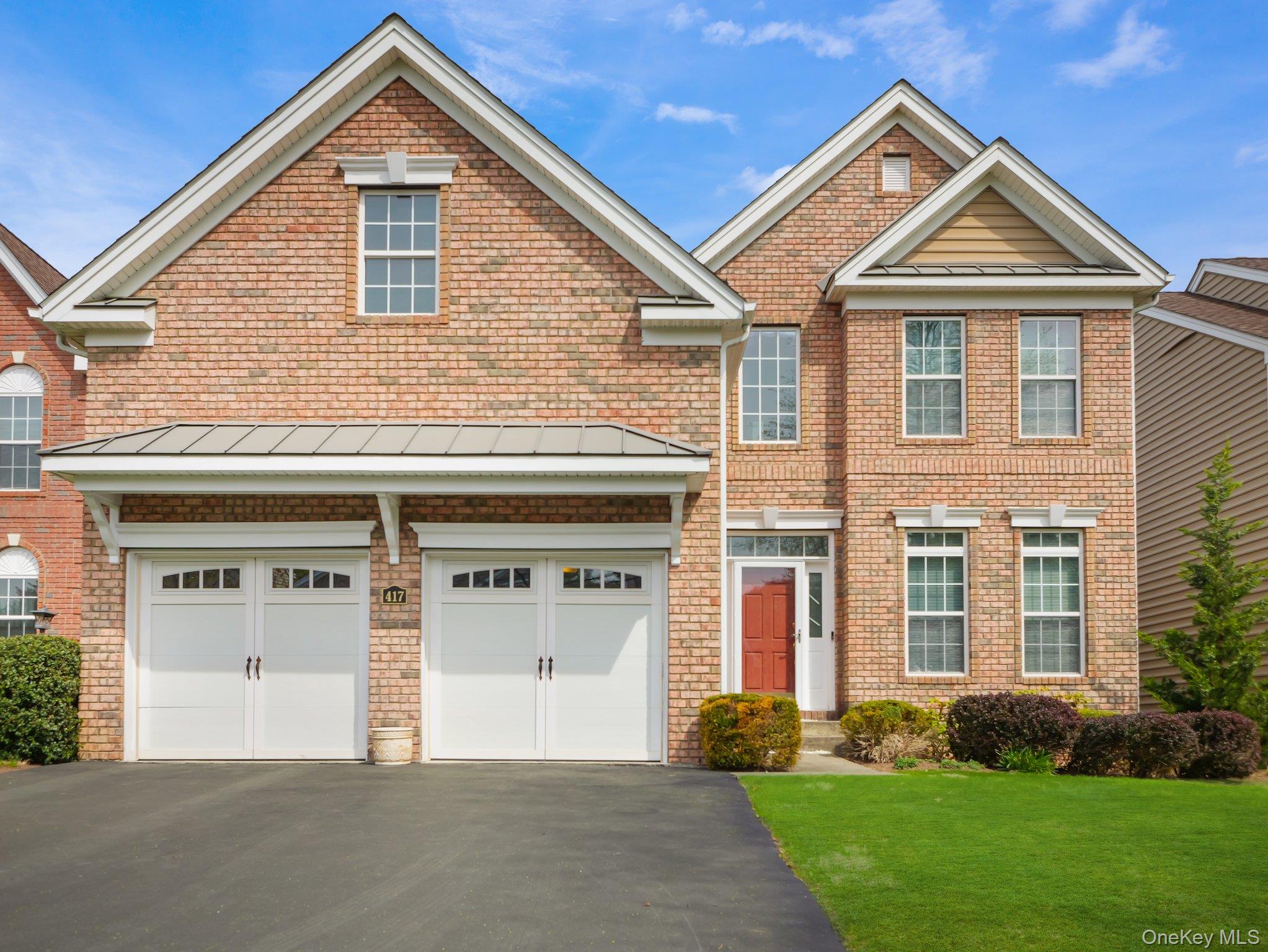417 Vassar Place Fishkill, NY 12524 - Photo 2 of 38 a front view of a house with garden