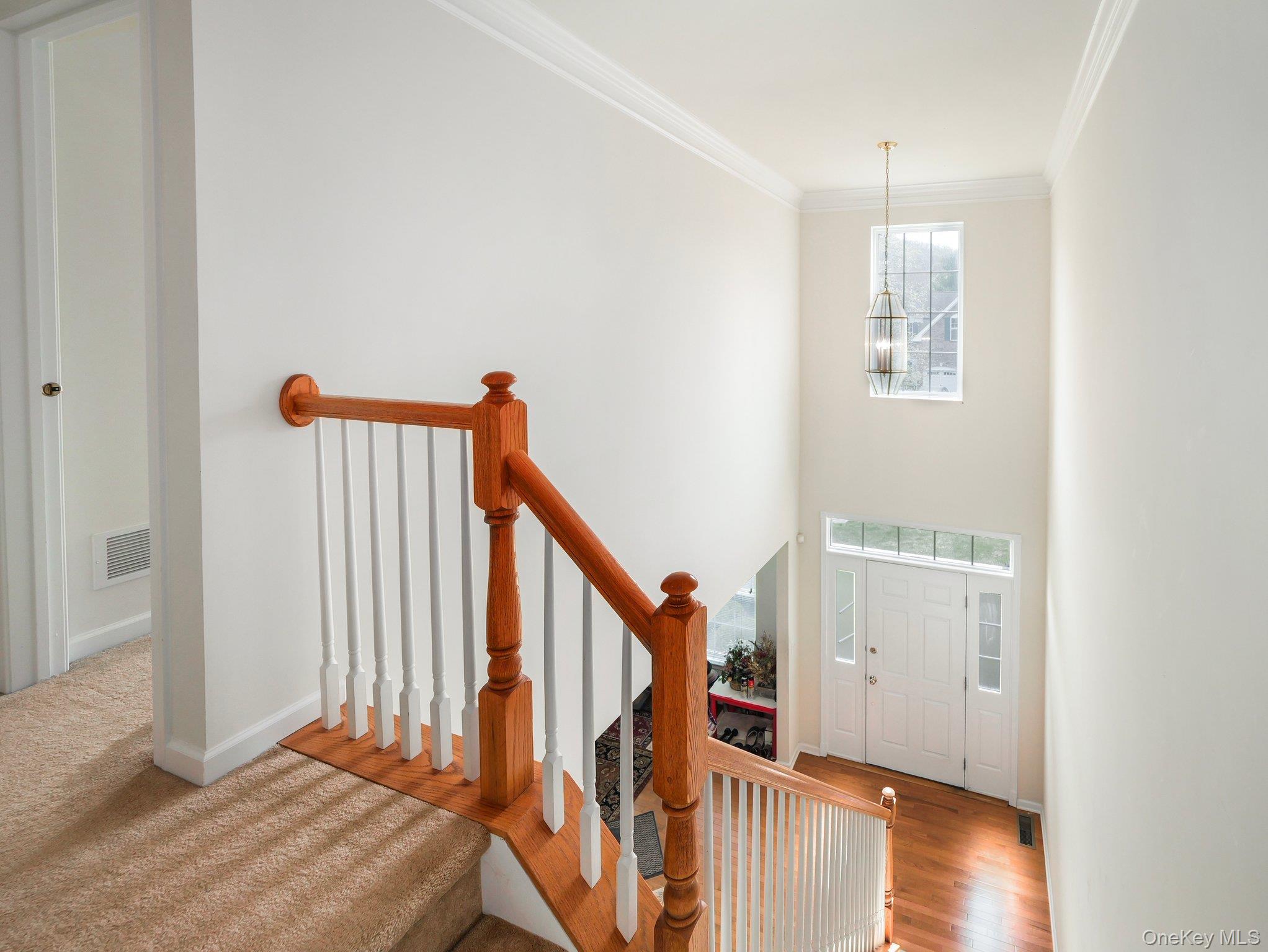 417 Vassar Place Fishkill, NY 12524 - Photo 32 of 38 a view of a hallway with wooden floor and staircase