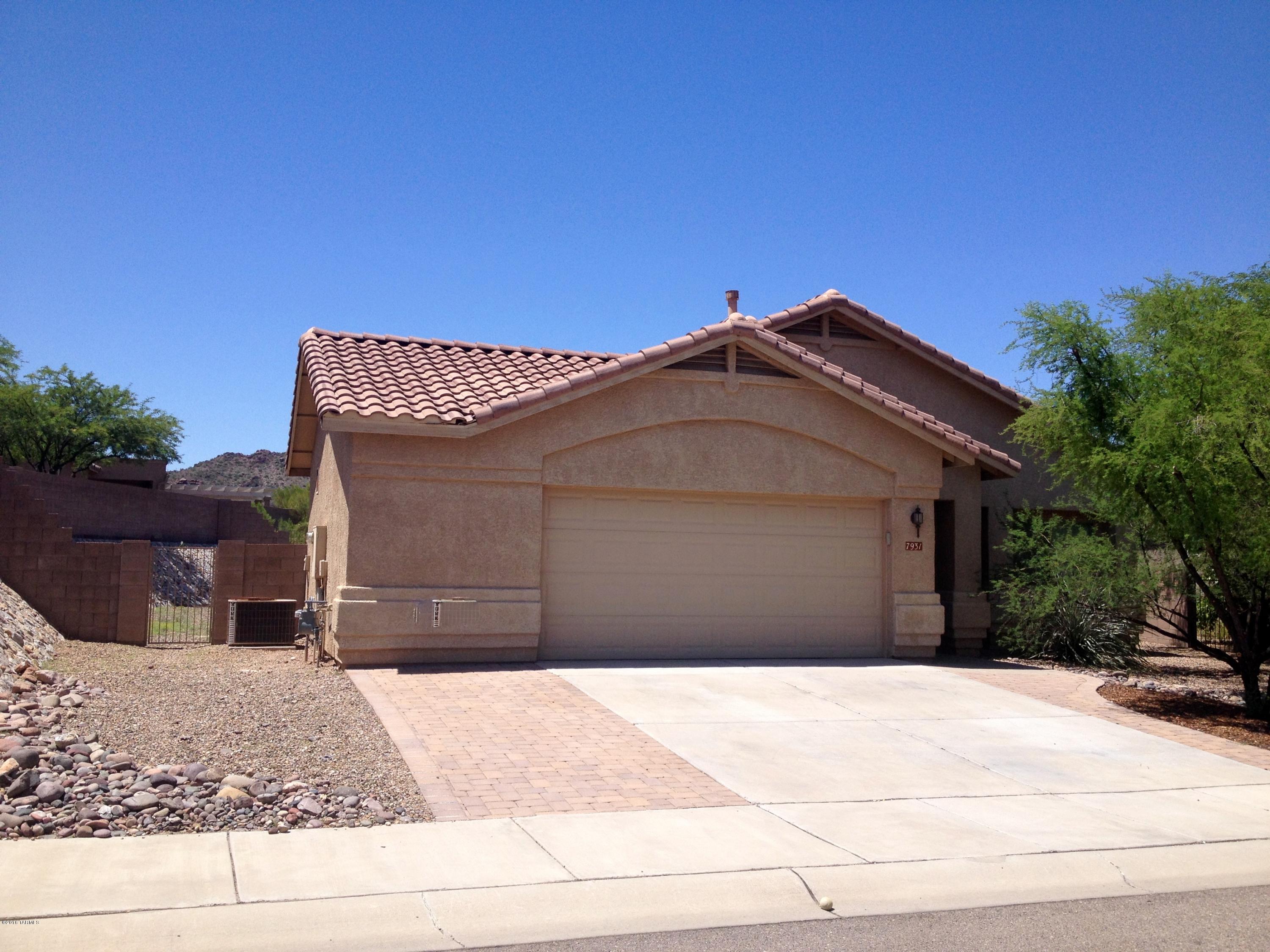 7931 North Iron Ridge Drive Tucson, AZ 85743 - Photo 1 of 21 a house view with a outdoor space