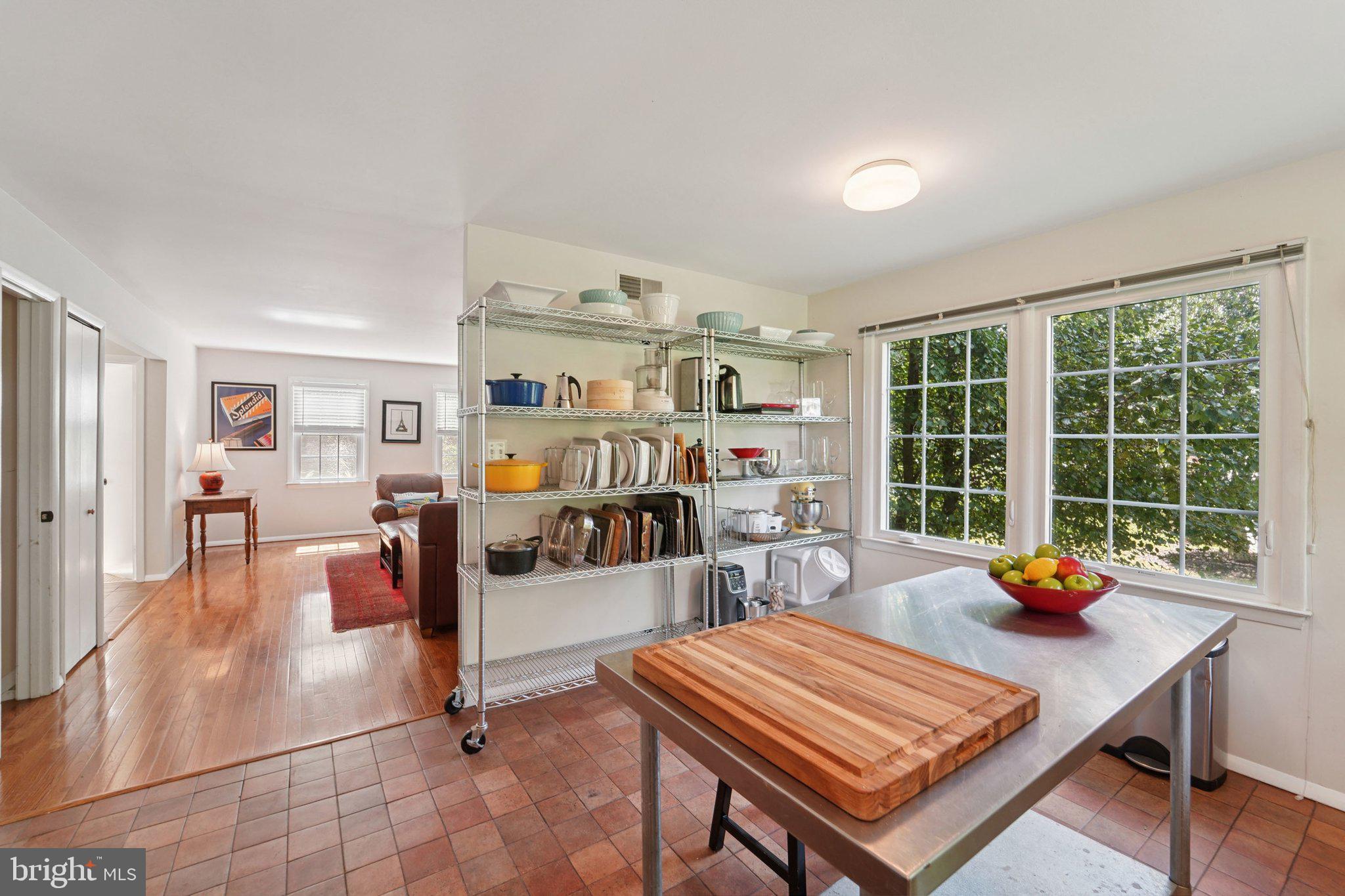 15108 Watergate Road Silver Spring, MD 20905 - Photo 11 of 33 a living room with furniture a rug and large window