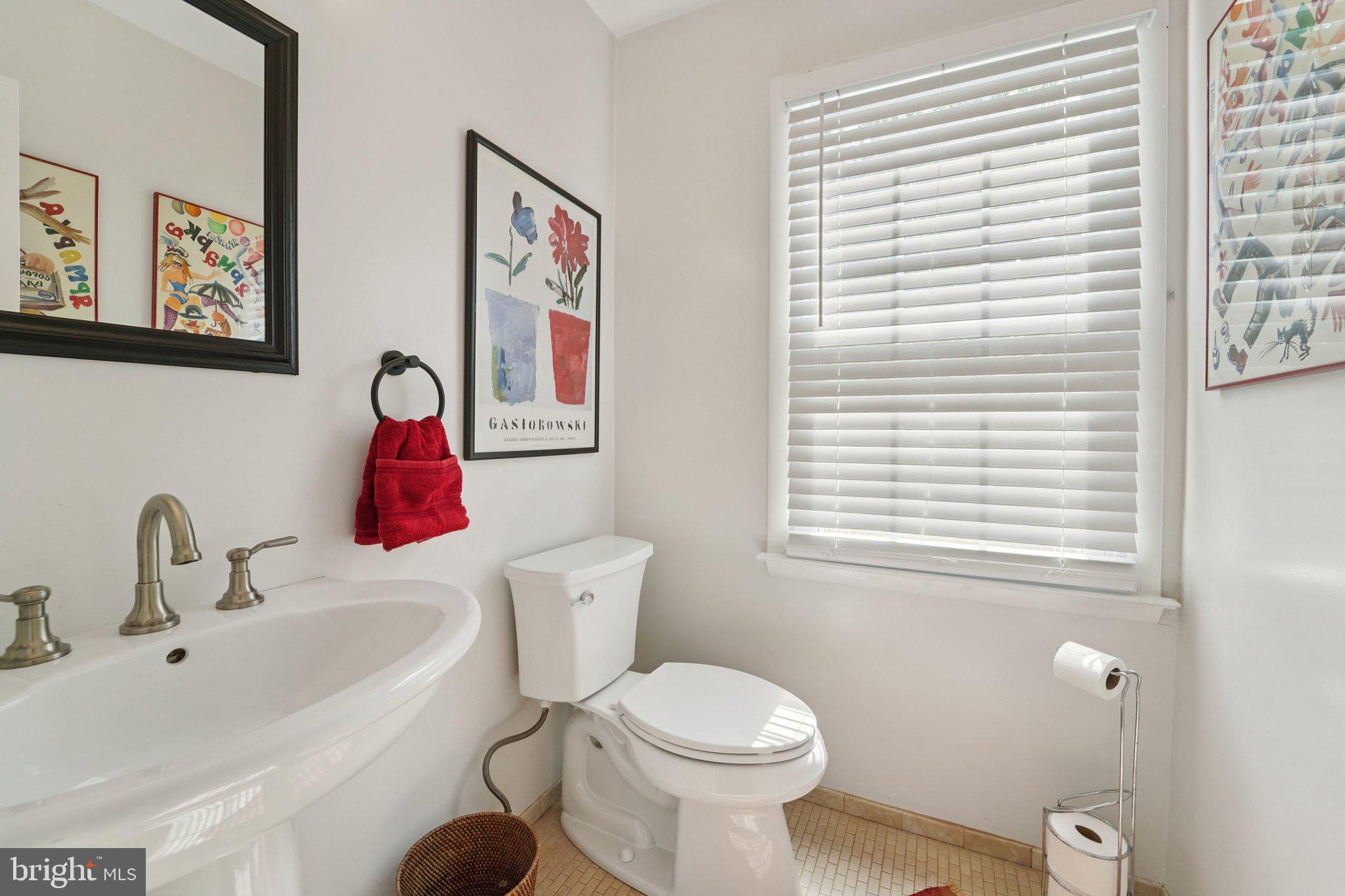 15108 Watergate Road Silver Spring, MD 20905 - Photo 14 of 33 a bathroom with a toilet a sink and a window