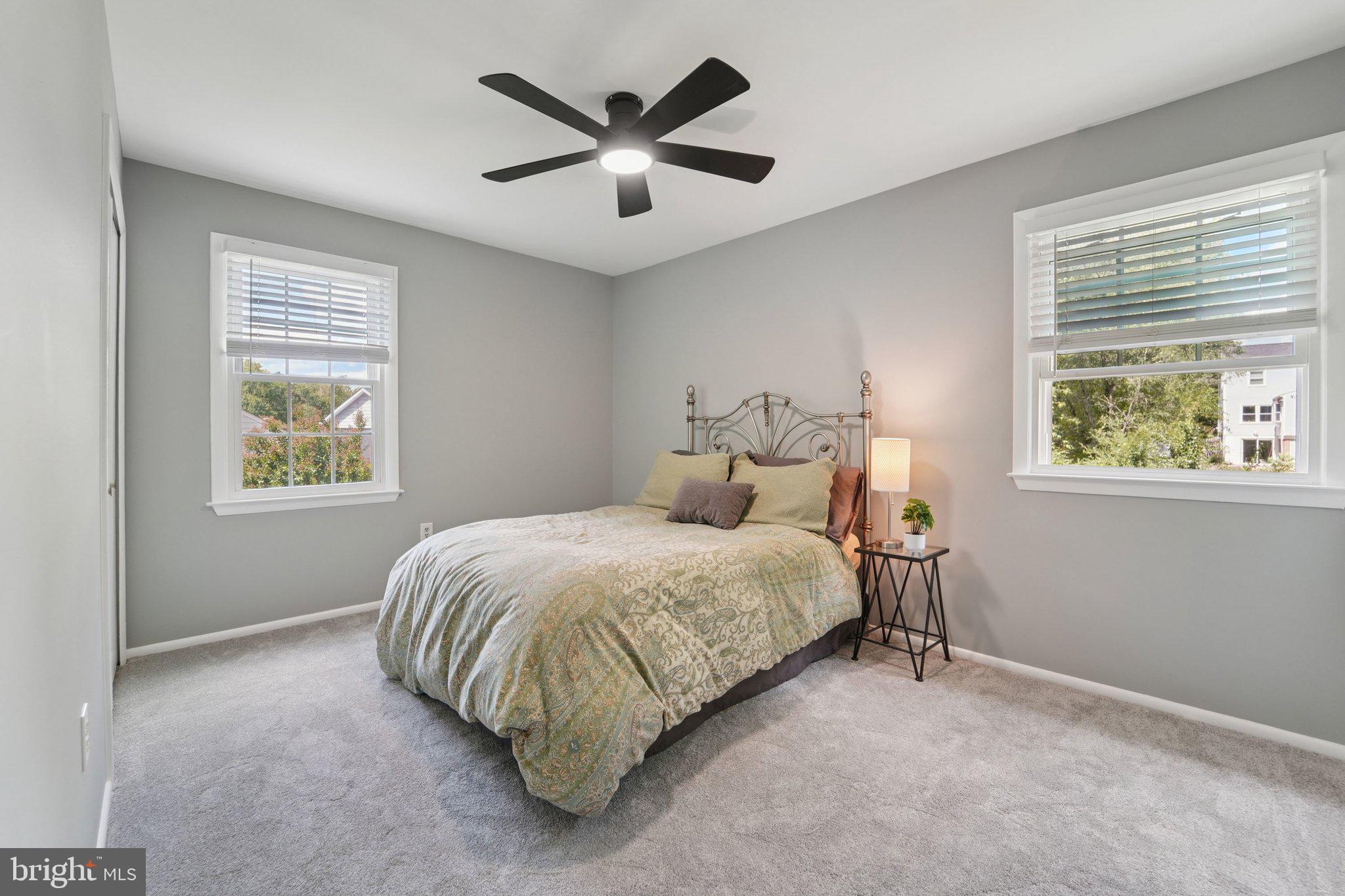 15108 Watergate Road Silver Spring, MD 20905 - Photo 18 of 33 a bedroom with a bed and a window