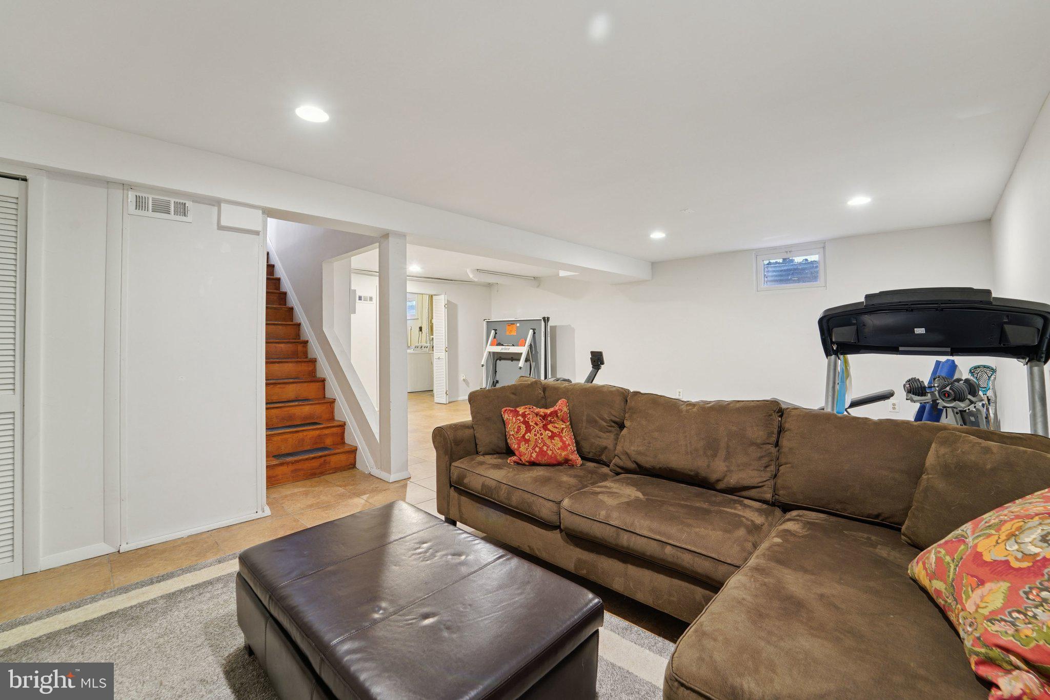 15108 Watergate Road Silver Spring, MD 20905 - Photo 22 of 33 a living room with furniture and a wooden floor