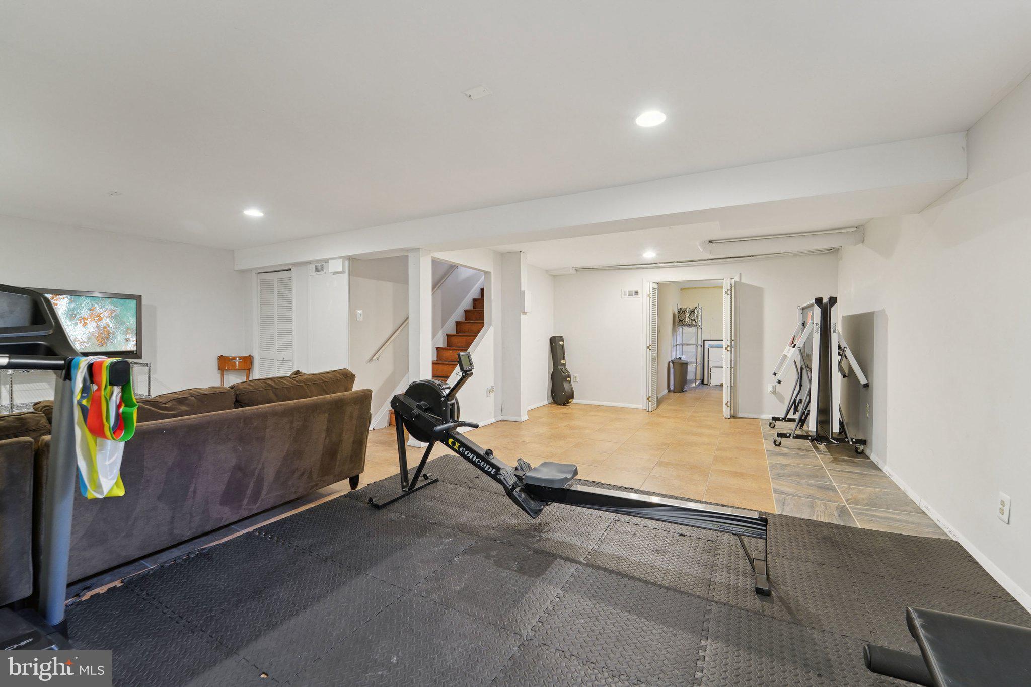 15108 Watergate Road Silver Spring, MD 20905 - Photo 23 of 33 a living room with furniture and a flat screen tv