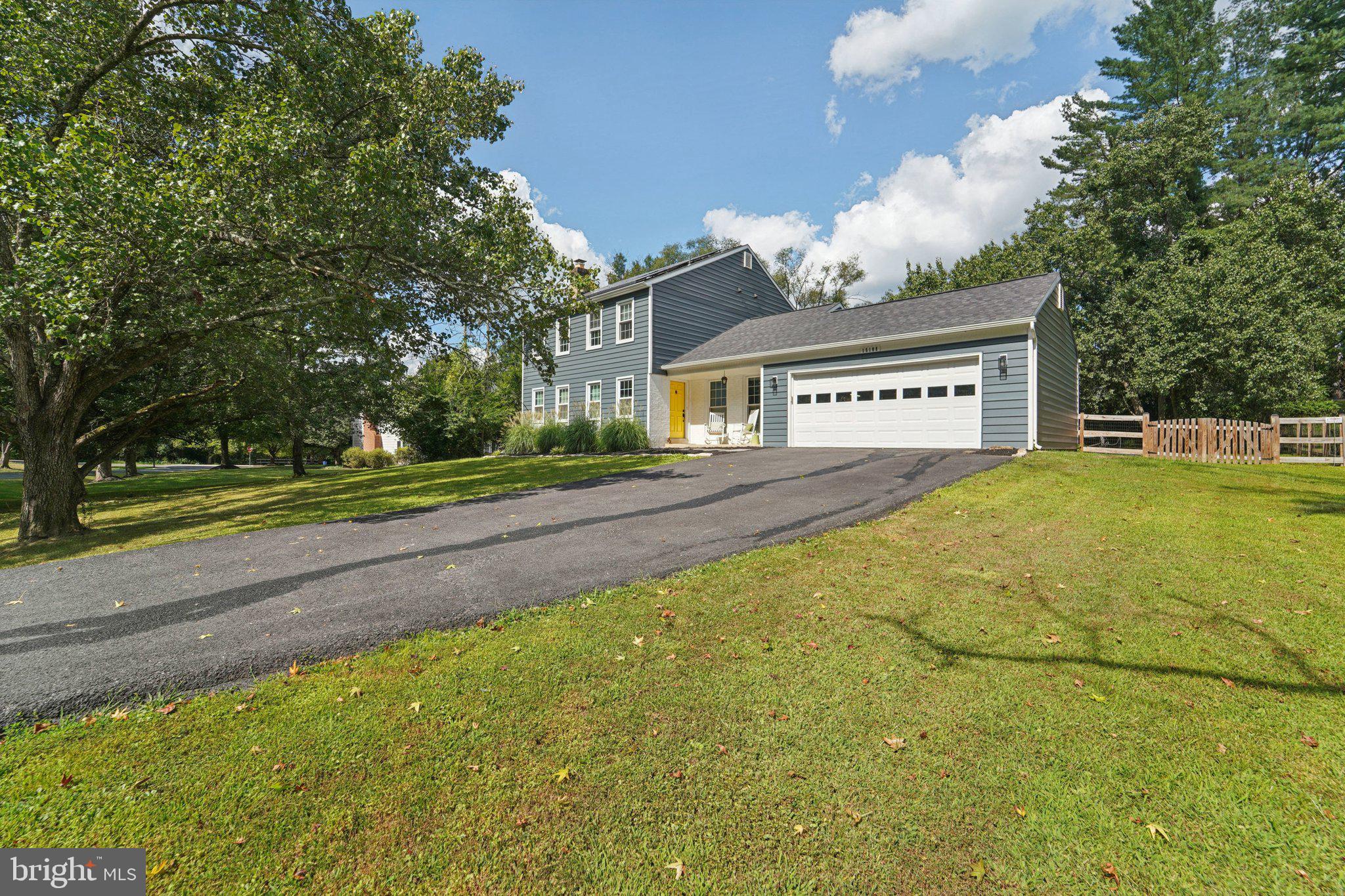 15108 Watergate Road Silver Spring, MD 20905 - Photo 30 of 33 a front view of a house with a yard and garage