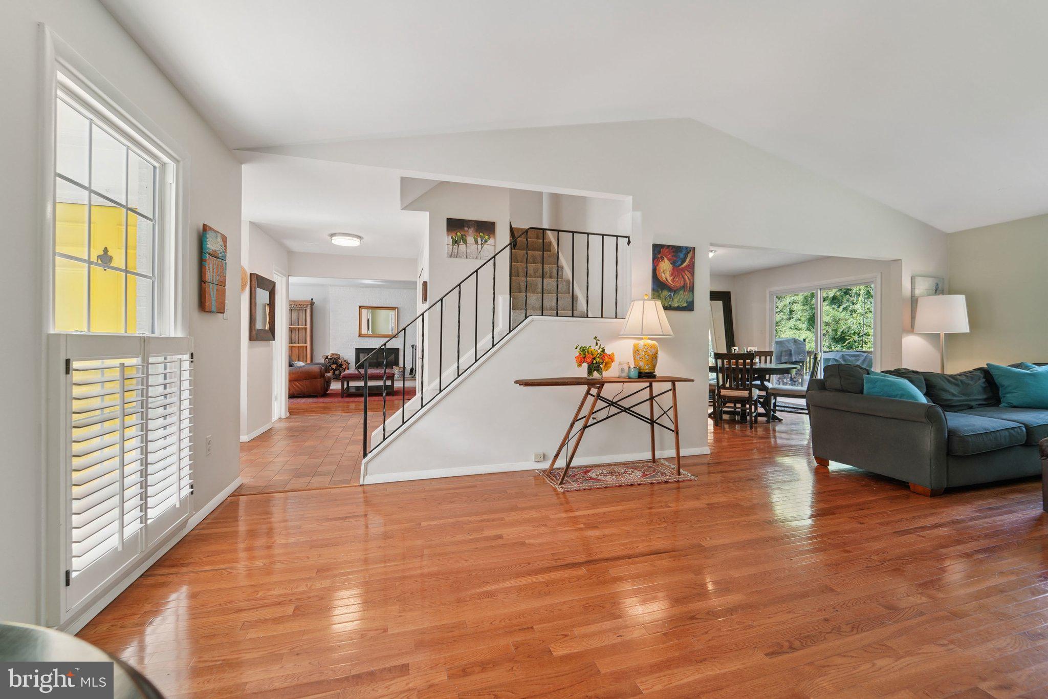 15108 Watergate Road Silver Spring, MD 20905 - Photo 3 of 33 a living room with furniture and a wooden floor