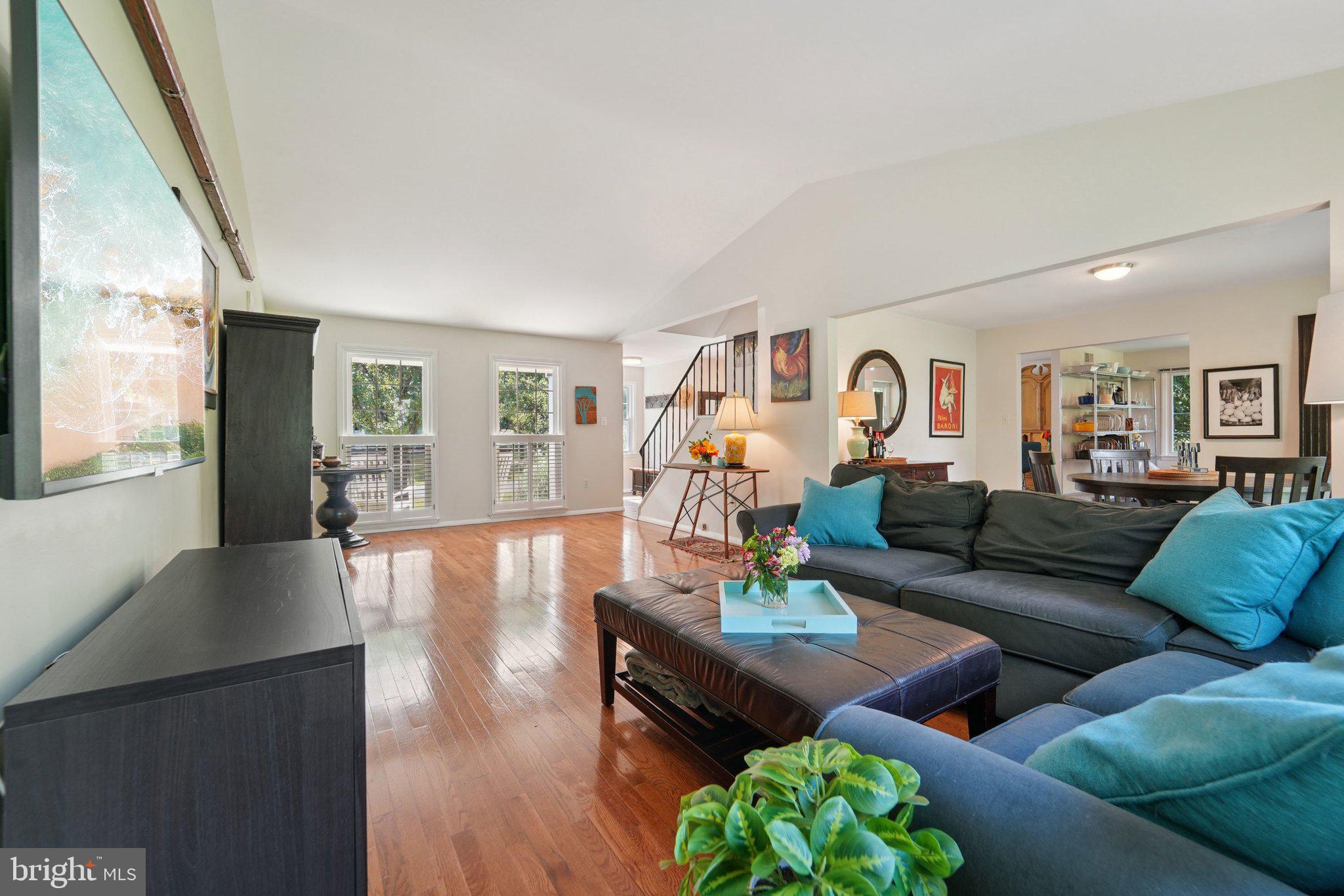 15108 Watergate Road Silver Spring, MD 20905 - Photo 4 of 33 a living room with furniture wooden floor and a large window