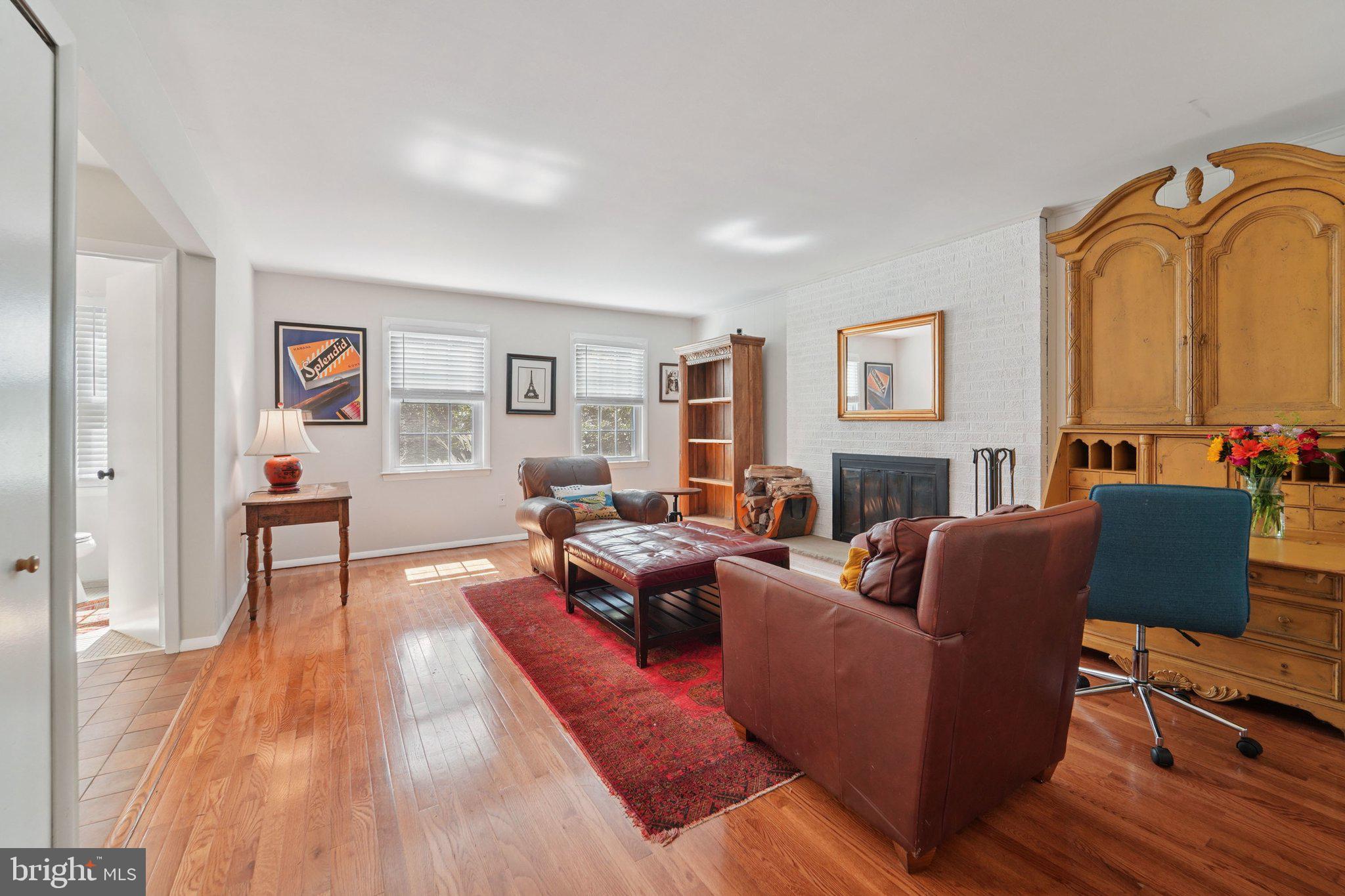 15108 Watergate Road Silver Spring, MD 20905 - Photo 5 of 33 a living room with furniture and a fireplace