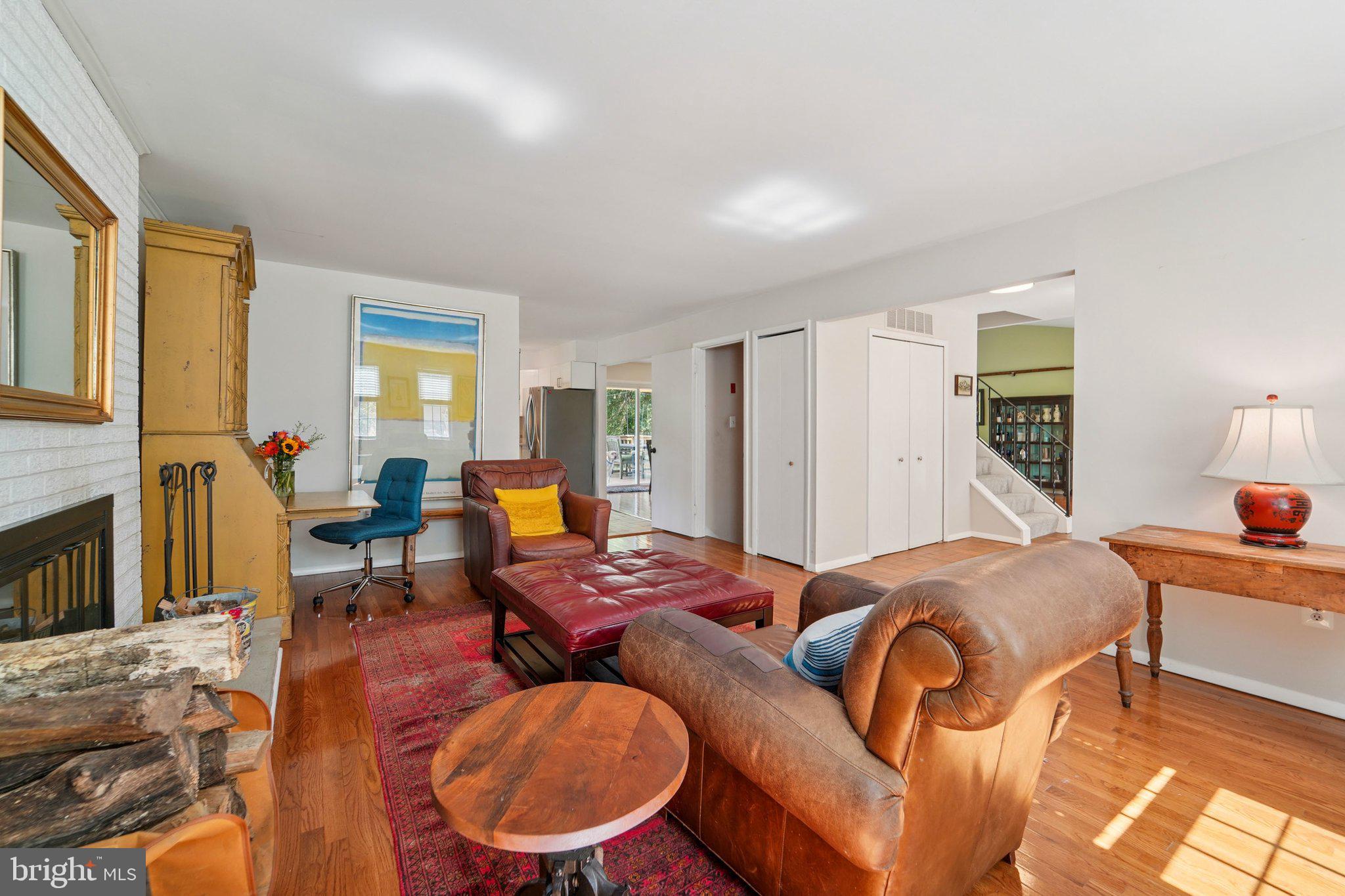 15108 Watergate Road Silver Spring, MD 20905 - Photo 6 of 33 a bedroom with furniture and a fireplace