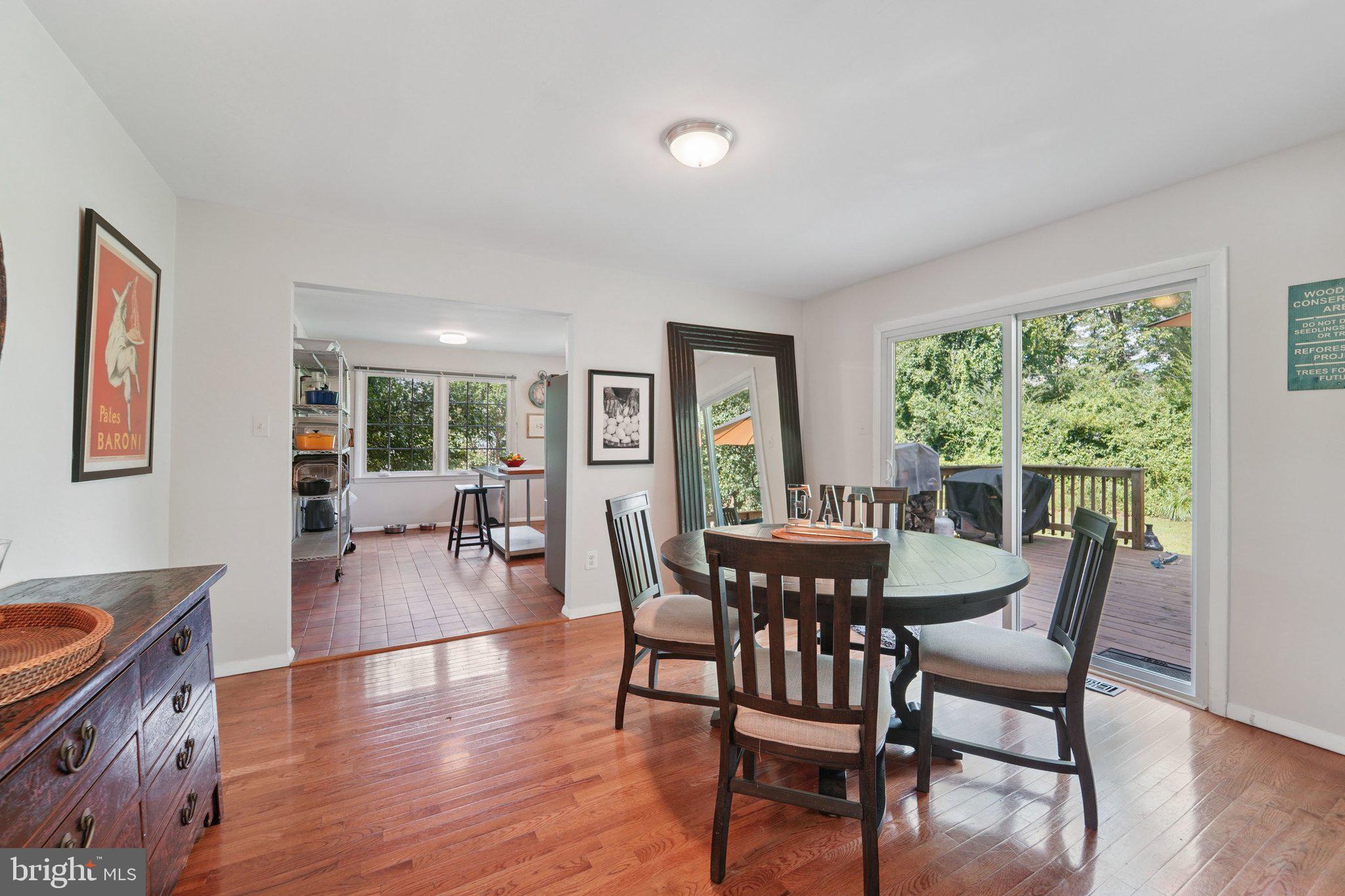 15108 Watergate Road Silver Spring, MD 20905 - Photo 7 of 33 a dining room with furniture and wooden floor