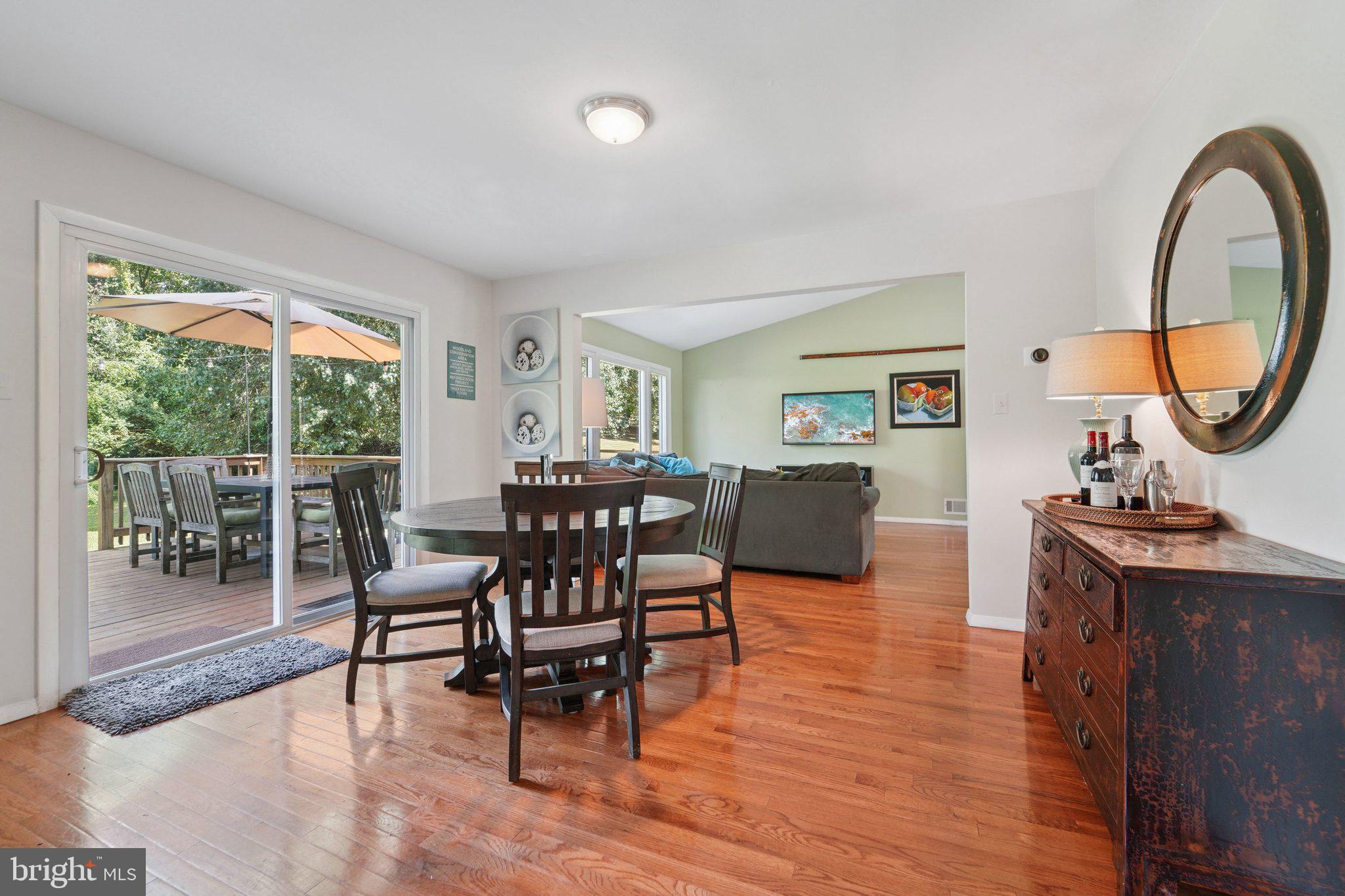 15108 Watergate Road Silver Spring, MD 20905 - Photo 8 of 33 a view of a dining room with furniture window and wooden floor