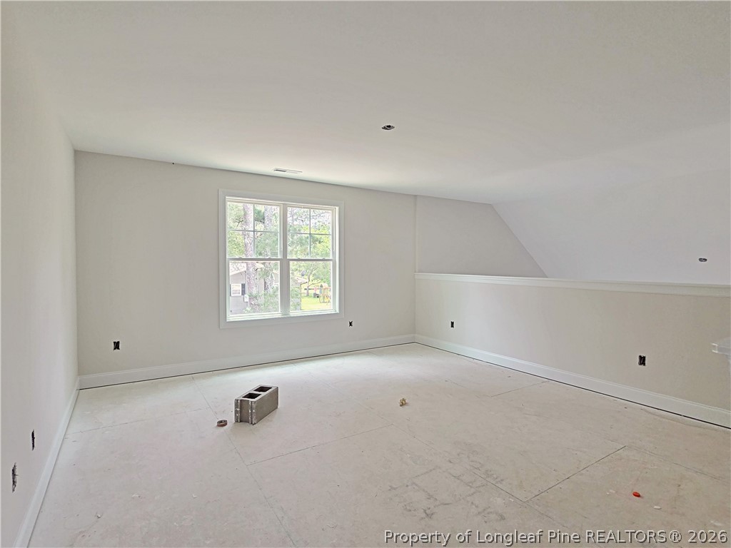 2678 Norrington Road Lillington, NC 27546 - Photo 19 of 31 a view of an empty room with a window