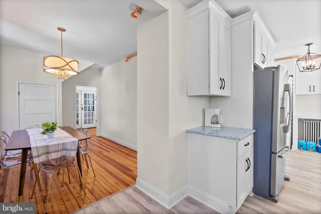 a kitchen with stainless steel appliances granite countertop a stove a microwave and a sink