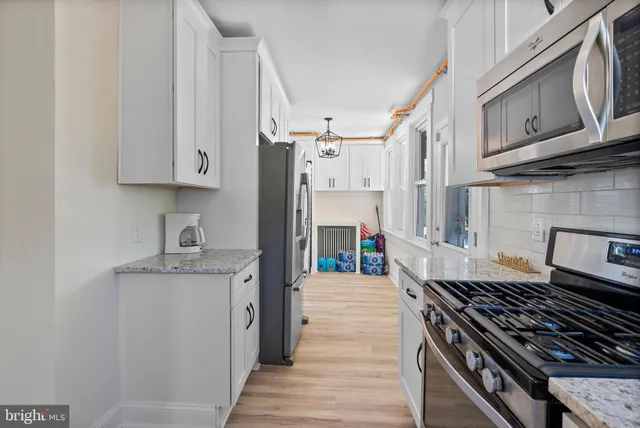 a view of a hallway with washer and dryer