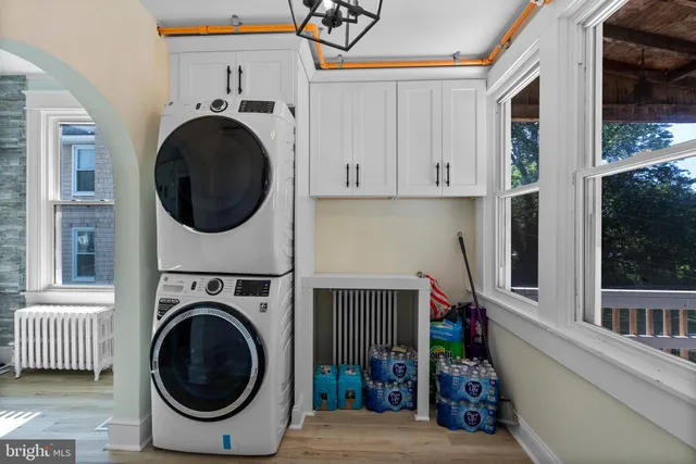 a living room with furniture and a ceiling fan