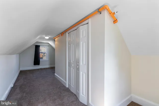 a view of a hallway with a white walls