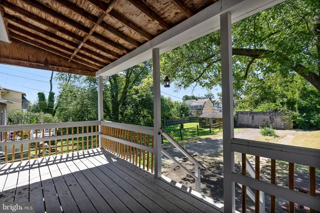 a view of a backyard with a tree
