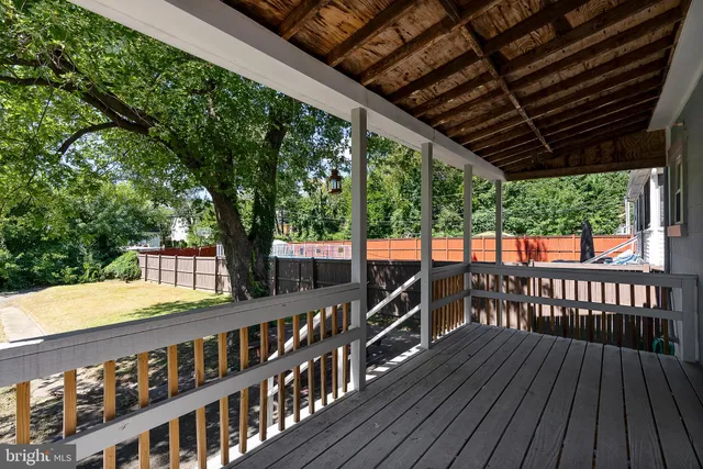 a view of a house with a yard and tree s