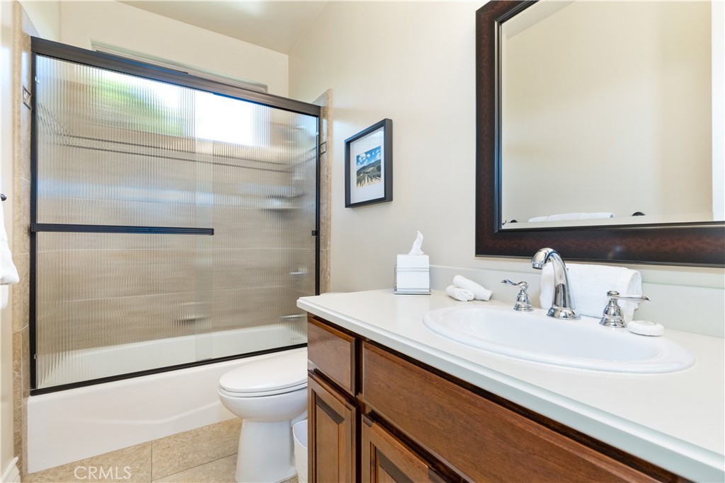669 Red Cloud Road Paso Robles, CA 93446 - Photo 30 of 61 a bathroom with a sink a toilet and shower