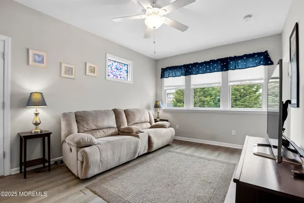 a living room with furniture and a window