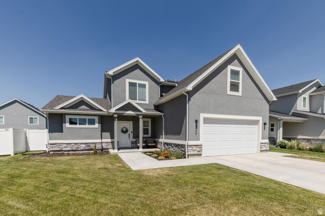 Contemporary gray stucco exterior with a stone veneer accent