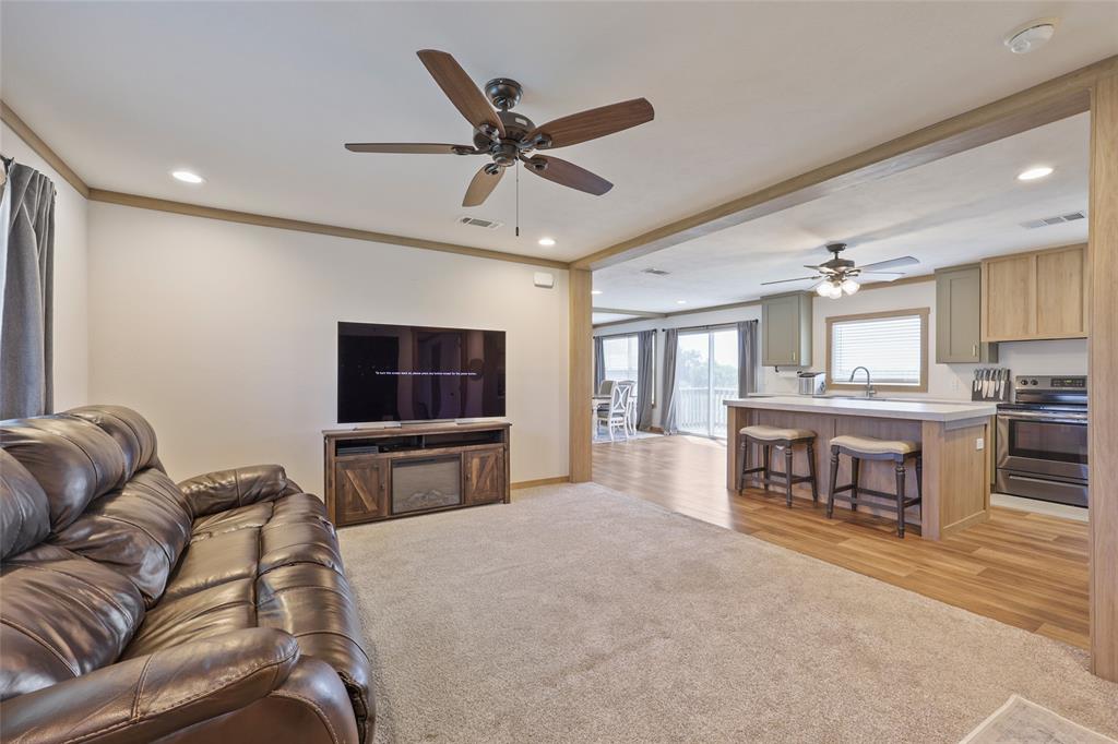 626 Epps Road Palmer, TX 75152 - Photo 18 of 27 Open-concept living space featuring wood-finish flooring, recessed lighting, and ceiling fans