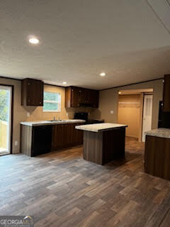 21 Trailer Park Road Hartwell, GA 30643 - Photo 8 of 11 a large kitchen with a large counter top stainless steel appliances and cabinets